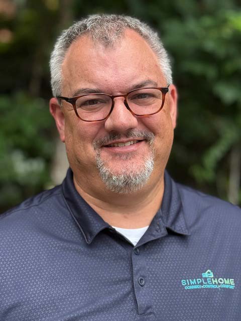 portrait of SimpleHome team member wearing a company-branded polo